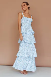 Detail view of a blue floral tiered maxi dress with adjustable straps and slim fit design.