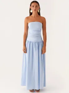 Detailed close-up view of the light blue strapless ruched maxi dress with pleated skirt.
