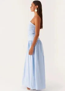 Side view detail of the light blue strapless ruched spliced maxi dress showing elegant drape.