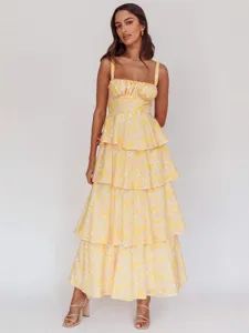 Elegant yellow and white floral print tiered maxi dress with adjustable straps for women