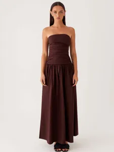 Brown strapless maxi dress featuring a ruched bodice and pleated skirt for women studio shot.