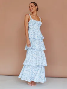 Elegant blue and white floral print sleeveless tiered maxi dress for summer wear