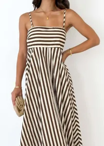 Detail view of brown and white striped high-waisted spaghetti strap maxi dress for women
