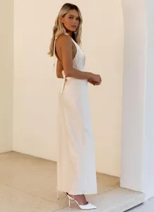 Side view of elegant white satin backless long dress featuring a tie neck design