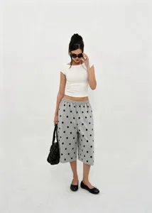 Full view of retro polka dot wide-leg pants with drawstring and an elastic waist.