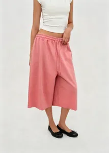 Full body view of women's pink retro wide-leg drawstring cropped pants worn by model
