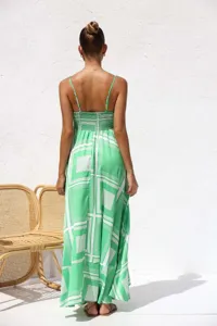 Detailed back view of a summer green and white printed maxi dress featuring a shirred bodice