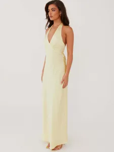 Elegant pale yellow satin halter maxi dress with deep V-neck and sexy backless design for women