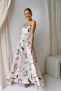 Elegant cream maxi dress with black sun print and spaghetti straps