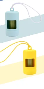 Close-up of portable silicone dog poop bag dispenser with lanyard and waste bag roll detail.