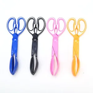 Detailed view of colorful plastic scissor-shaped pet waste scoopers for easy daily cleaning.