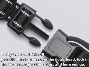 Detailed view of the quick-release plastic buckle on a reflective black nylon dog harness
