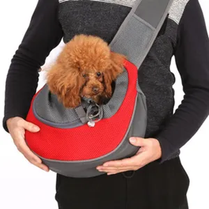 Close-up detail of a breathable mesh pet sling carrier worn with a small brown dog