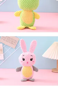 Detail view of pink bunny squeaky plush toy featuring a unique corn kernel texture.