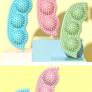 Detailed macro view of pea-shaped TPR dog chew toys with textured bumps for teeth cleaning