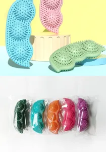 Pea-shaped TPR dog chew toys in multiple colors with individual plastic wrap packaging.