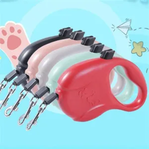 Detail view showing retractable pet leashes in five vibrant colors with secure metal clips