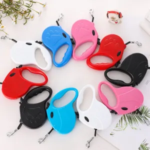Colorful retractable cat leashes with paw print design arranged in a circular display