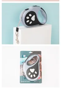 Laisse rétractable pour animaux avec lumière LED et motif de patte sous emballage