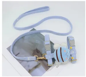 Detail of light blue corduroy dog harness leash set with cute plush bee decoration