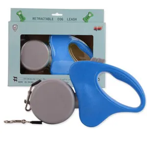 Close-up of blue and grey retractable dog leash showing 5m cord and retail packaging box