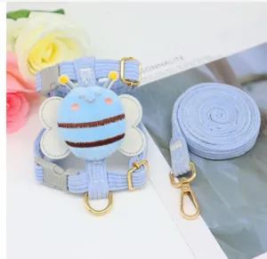 Close-up of cute light blue corduroy pet harness with plush bee design detail set