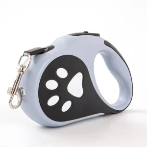 Laisse rétractable bleue pour chien avec lumière LED intégrée et motif de patte