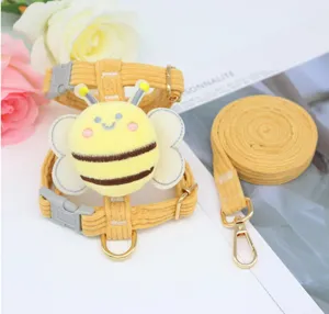 Detailed view of the cute bee plush on a yellow corduroy pet harness set