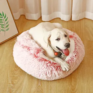 Ultra soft pink plush round pet bed for dogs and cats featuring a cozy calming design