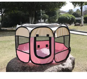 Portable pink foldable pet playpen tent made of oxford cloth shown in an outdoor park setting
