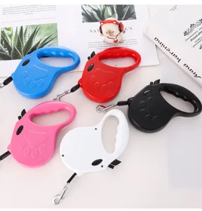 Collection of retractable pet leashes in five vibrant colors featuring a paw print design