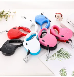 Automatic retractable pet leashes in various colors with a cute paw print design
