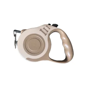 Khaki automatic retractable dog leash with ergonomic handle and bone pattern design
