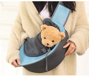Close-up of a breathable mesh pet sling carrier worn by a model featuring a cute teddy bear prop