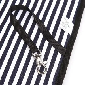 Detail of navy striped portable pet carrier bag featuring sturdy metal lobster clasp