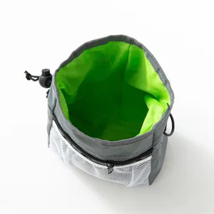 Portable pet training treat pouch in grey with neon green lining and drawstring