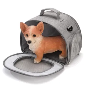 Portable breathable grey pet carrier bag with model dog showing interior space