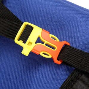 Close-up of durable yellow and orange buckle on a blue pet carrier backpack strap.
