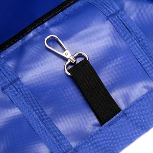 Detail of safety hook and leash attachment inside blue breathable pet carrier bag