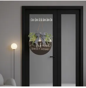 Decorative wooden round door hanger with eucalyptus and striped bow in a home setting