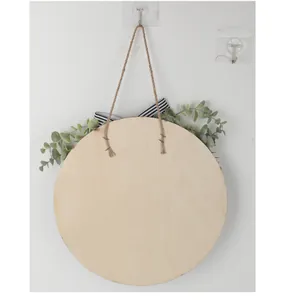 Rear view of round wooden door hanger with twine rope attached by industrial staples