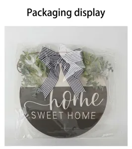 Detail of round wooden home sweet home door sign in plastic packaging