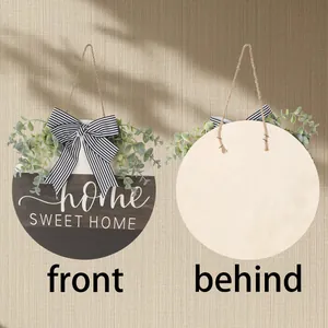 Round wooden door hanger with eucalyptus and striped bow featuring Home Sweet Home