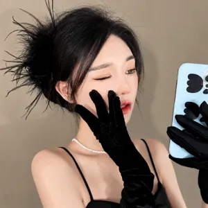Ostrich feather hair claw clip for elegant bun styling, premium fluffy fashion hair accessory.