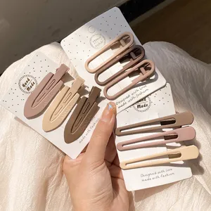 Matte minimalist hair clips set, detail view of earth tone snap clips and duckbill clips.