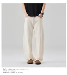 Close-up details of men's casual wide-leg denim jeans in versatile off-white color.