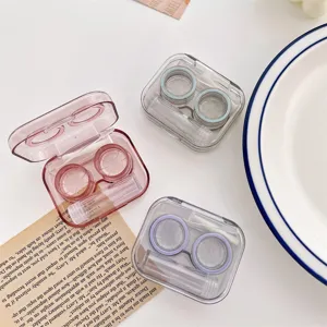 Detail view of portable transparent contact lens cases in three stylish colors