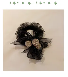 Chouchou de cheveux en filet noir avec boules de strass nœud queue de cheval accessoire.