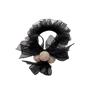 Chouchou en filet noir avec boules en strass cristaux et noeud pour femme queue de cheval