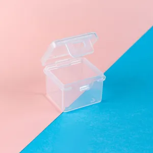 Macro view of mini transparent square PP plastic storage box with an open flip lid design.